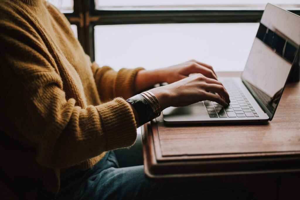 Photo of a person typing on a laptop computer, used to adorn our FileMaker services page.