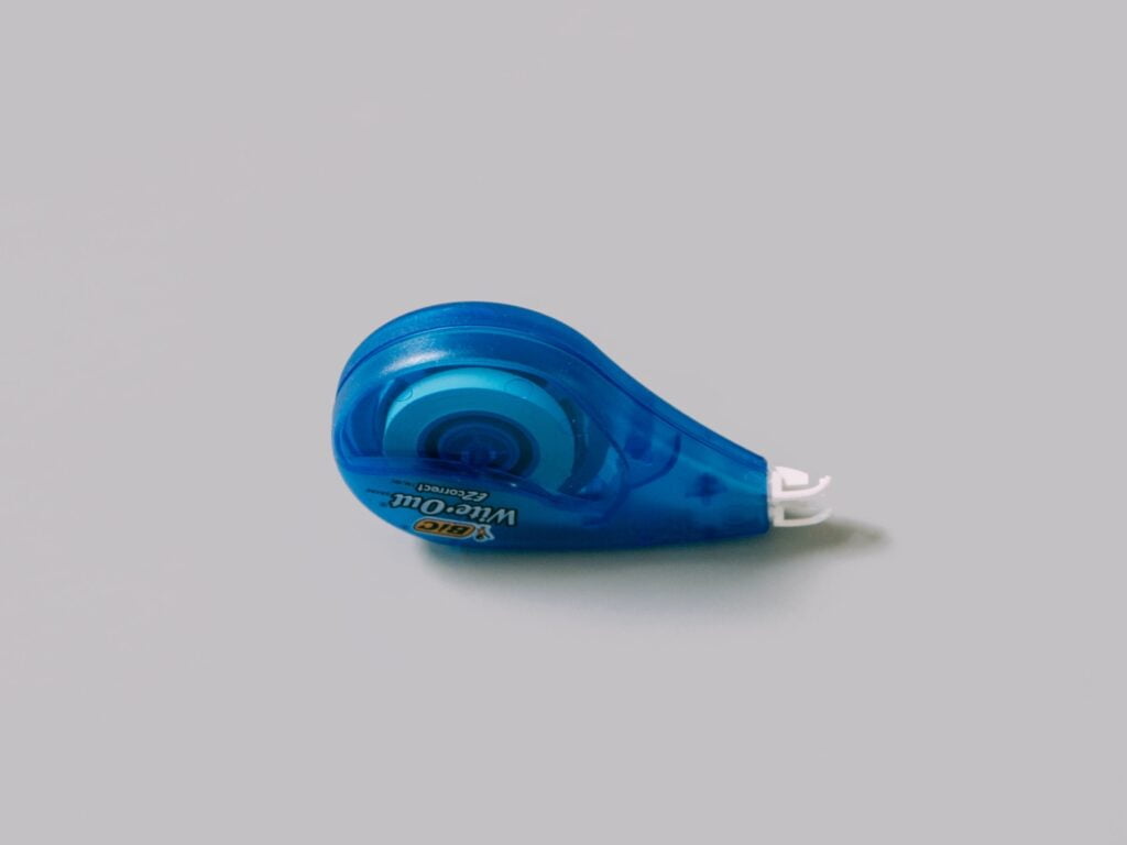 Wite-Out correction tape for covering mistakes.